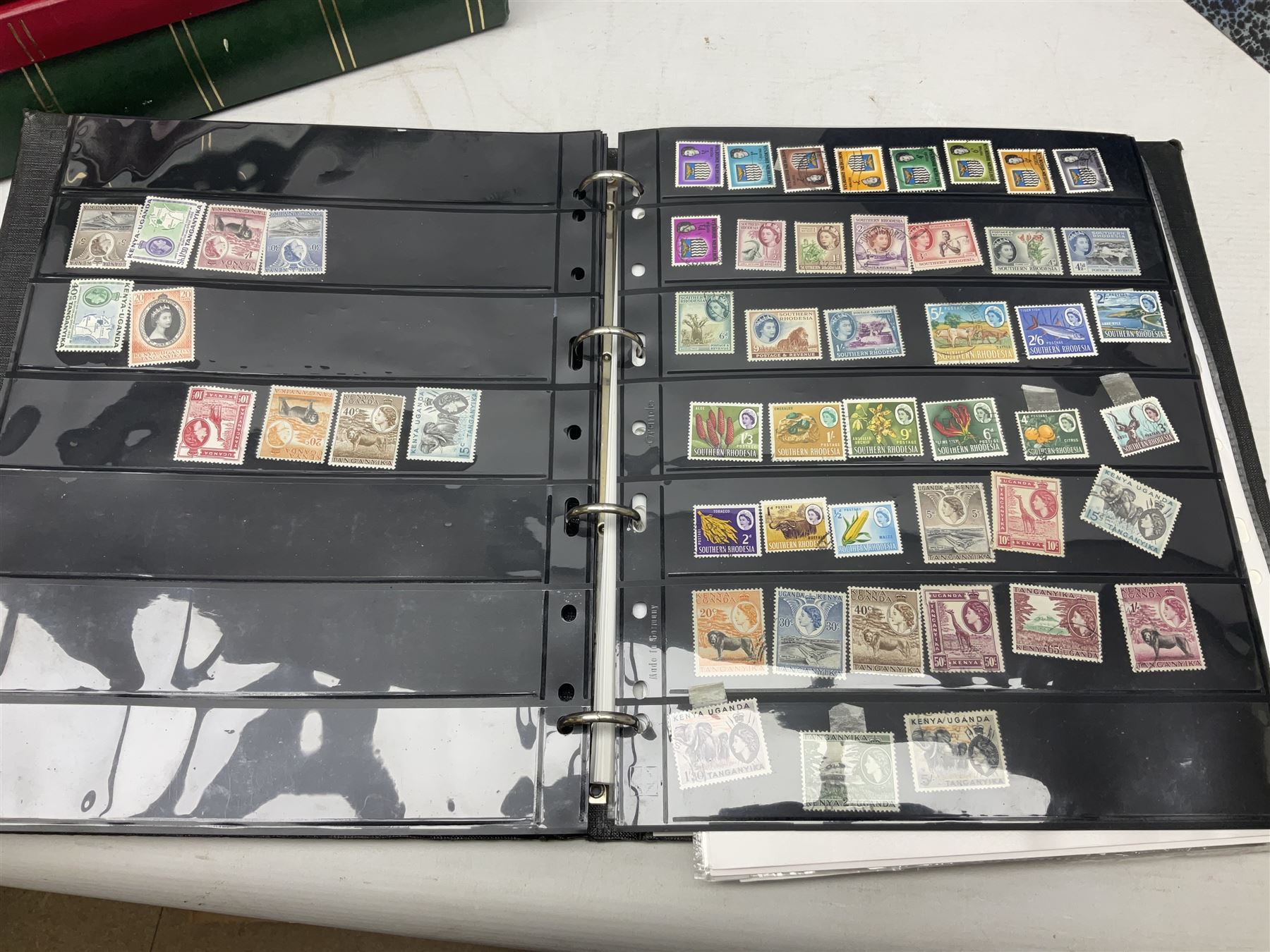 Stamps including Queen Victoria Queensland, modern Australia, King Edward VII Ceylon and Mauritius, South Africa, Gambia, Falkland Islands, Gold Coast, Ireland etc, housed in seven albums/folders and on loose album pages, in one box