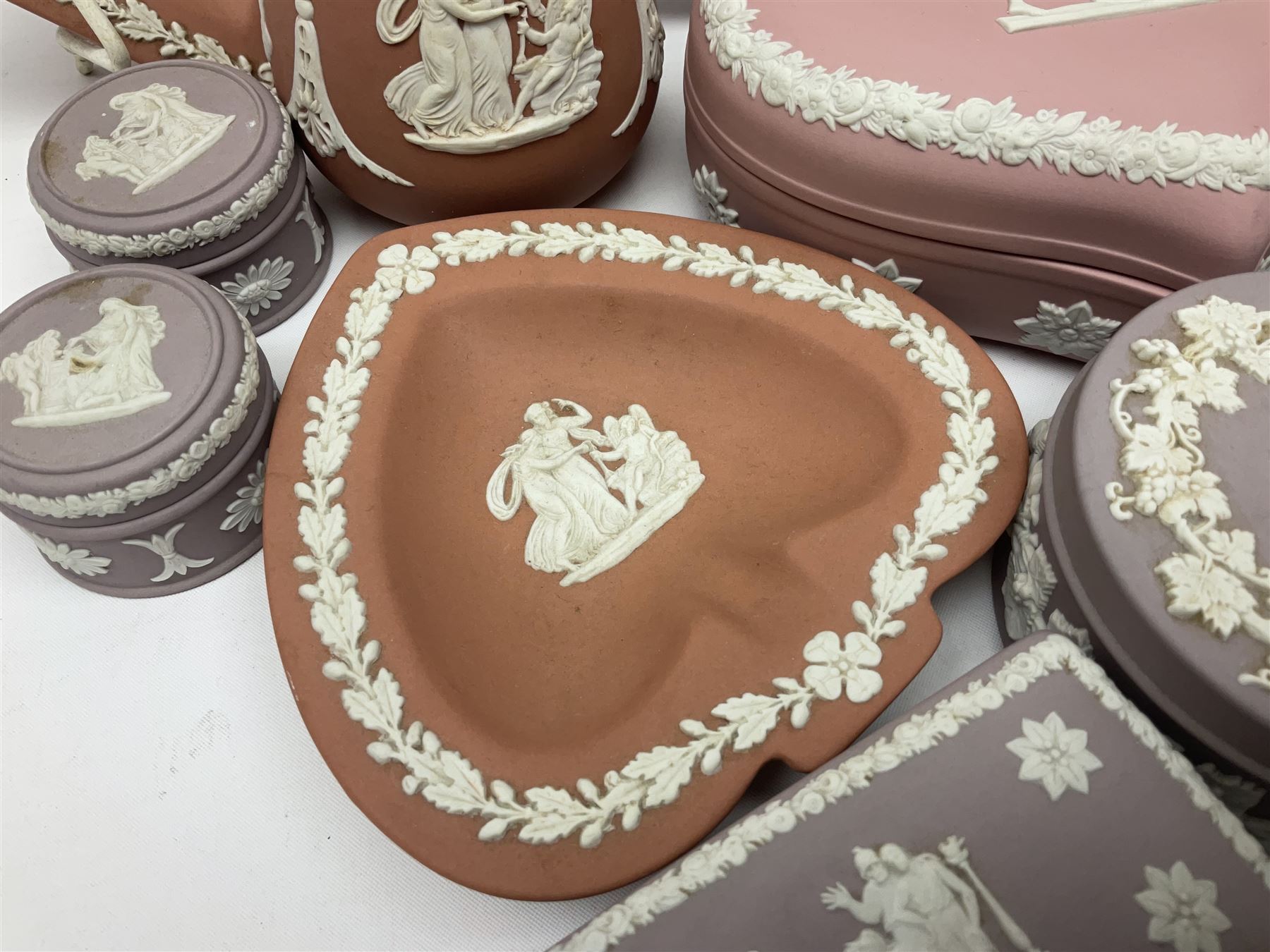 Collection of Wedgwood Jasperware, in orange, lilac and pink colourways, including oval tray, small jug, trinket boxes, trinket dishes, etc , all with impressed mark beneath