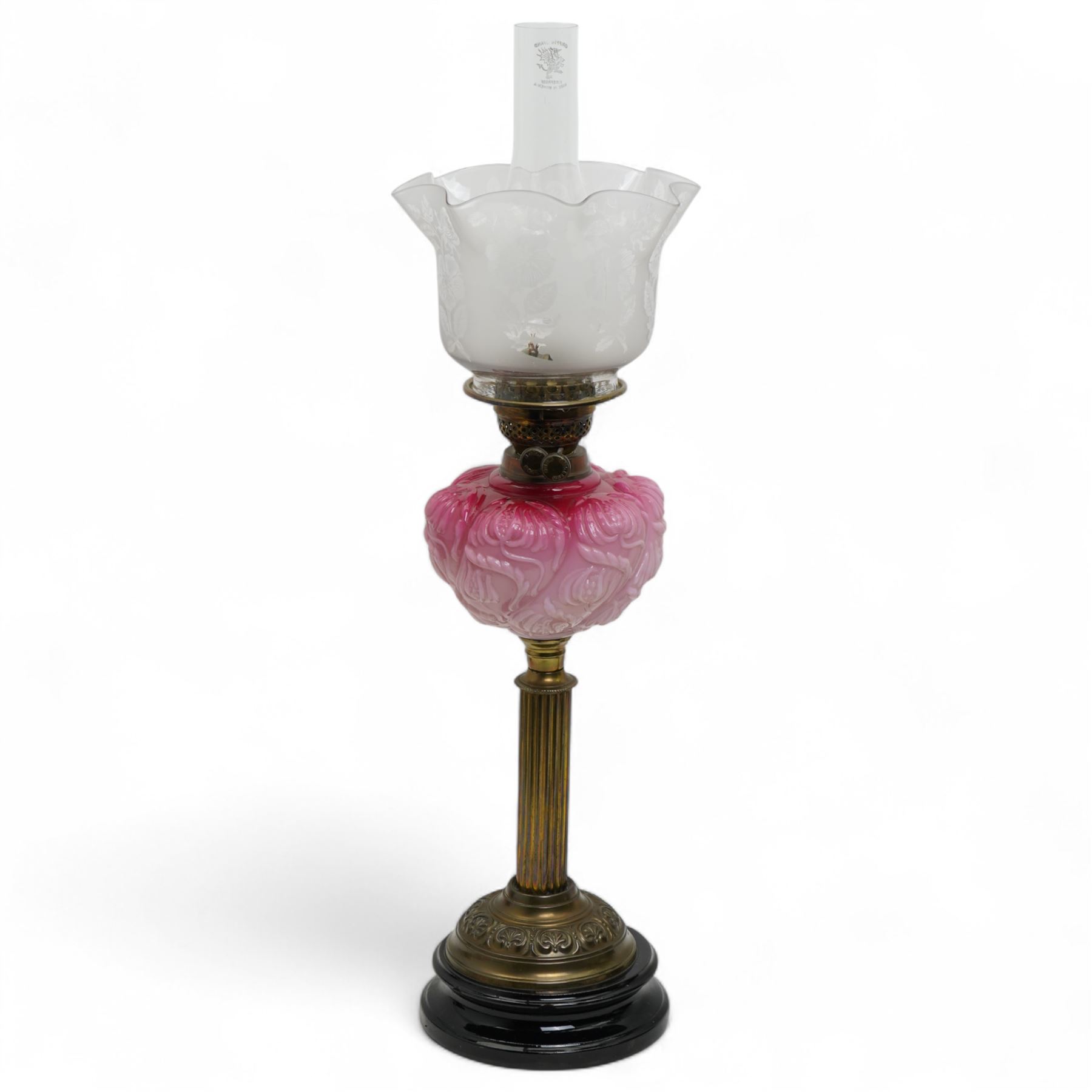 Victorian brass column table oil lamp with pink glass reservoir and etched shade H61cm and a smaller lamp with opaque shade
