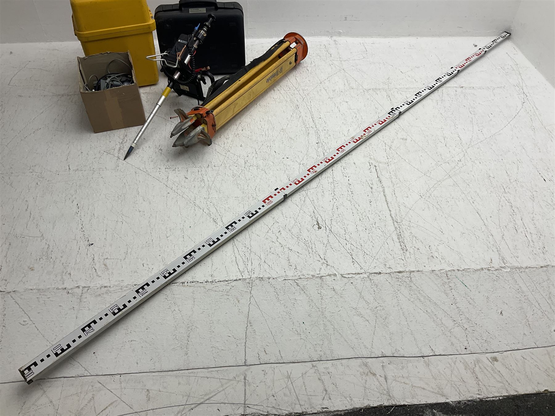 Trimble land surveying equipment - 5000 Series 5603 DR300+ Robotic Reflectorless Total Station, serial no.84310406; in carrying case; together with GPS Holder 58317019, serial no.95320184; ACU 571225500, serial no.83214786; Docking Station 58252019, serial no.95823458 with Power Supply; RMT 606 Remote Target on pole with CU Holder and External Georadio 2.4GHz; cased Power Pack Kit; folding tripod; and aluminium 5m telescopic measuring staff