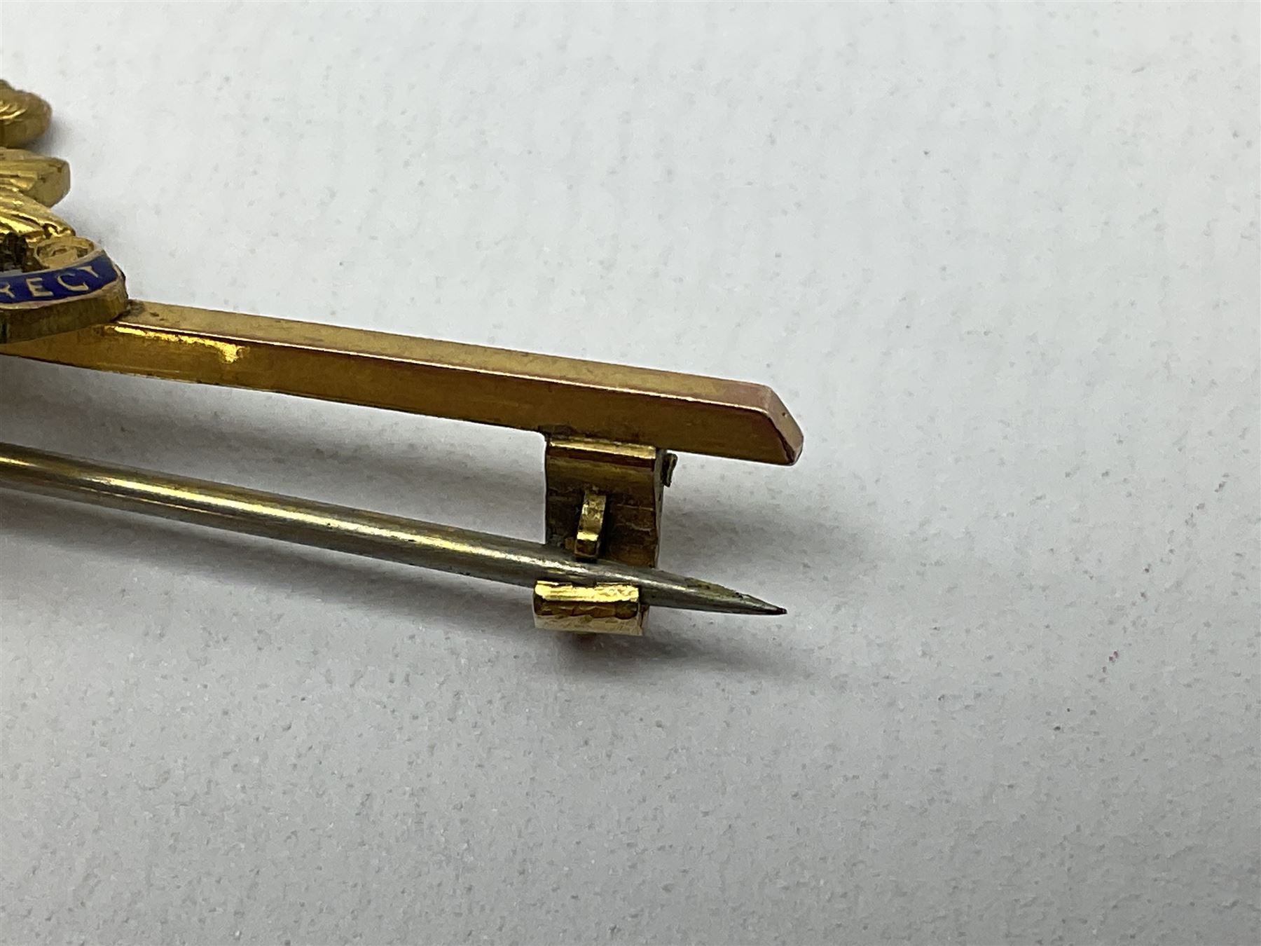 Royal Sussex Regiment 9ct gold sweetheart brooch with Regimental Association membership card to 6406670 Pte. Brock dated 1940; an 18ct gold pin badge enamelled with a shipping company (?) pennant; and an ARP button-hole badge (4)