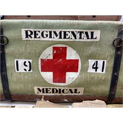 WW2 British Army RAMC 'Regimental Medical Pannier', well marked externally and dated 1941, stamped May 1943 internally, canvas covered wicker form with leather edges, hinged top and fall front with two rope carrying handles, fitted iron locking straps with securing chains; contains various unused field dressings and bandages with WW2 dates and two pillows; original label under lid L79cm