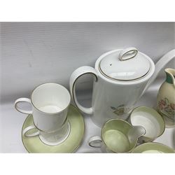 Susie Cooper Dresden Sprays pattern breakfast set, including coffee pot, sugar bowl, milk jug, egg cup, teacup trio and bowl, together with a Susie Cooper Wild Rose pattern coffee service for six