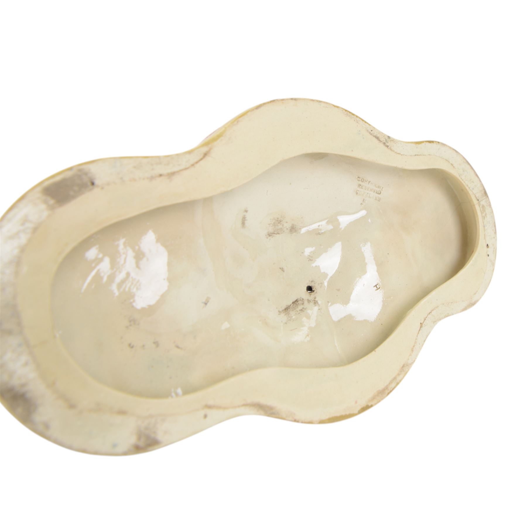 Late 19th century Copeland majolica centrepiece, circa 1874, modelled as two putto standing with fishing net draped between them, their catch spilling onto the quatrelobed base beneath, with impressed mark beneath, H24cm W33cm 