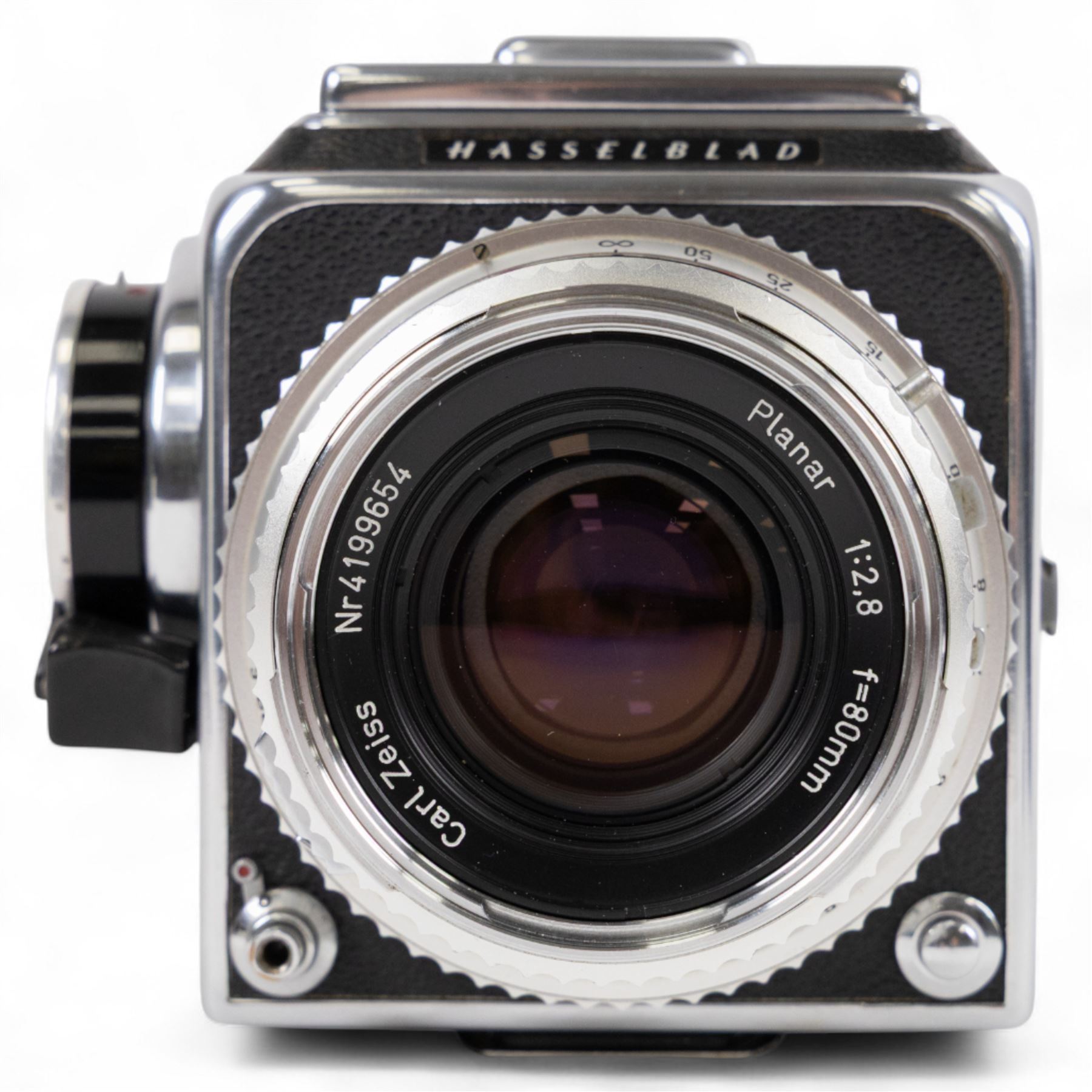 Hasselblad 500C medium format camera, serial no. TC60836, circa 1965, with Carl Zeiss Planar 1:2.8 f=80mm lens with cap, serial no. 4199654, one film back, serial no. TC87300 and a Hasselblad PM5 prism viewfinder serial no. 401EE1335