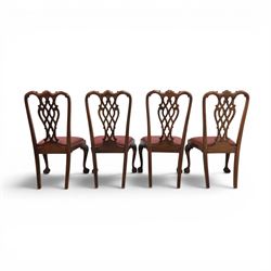 Chippendale design set of ten (8+2) mahogany dining chairs, serpentine cresting rails with carved detail over pierced ribbon-tied splats, red damask upholstered drop-in seats, on cabriole supports with acanthus carved knees and claw and ball feet