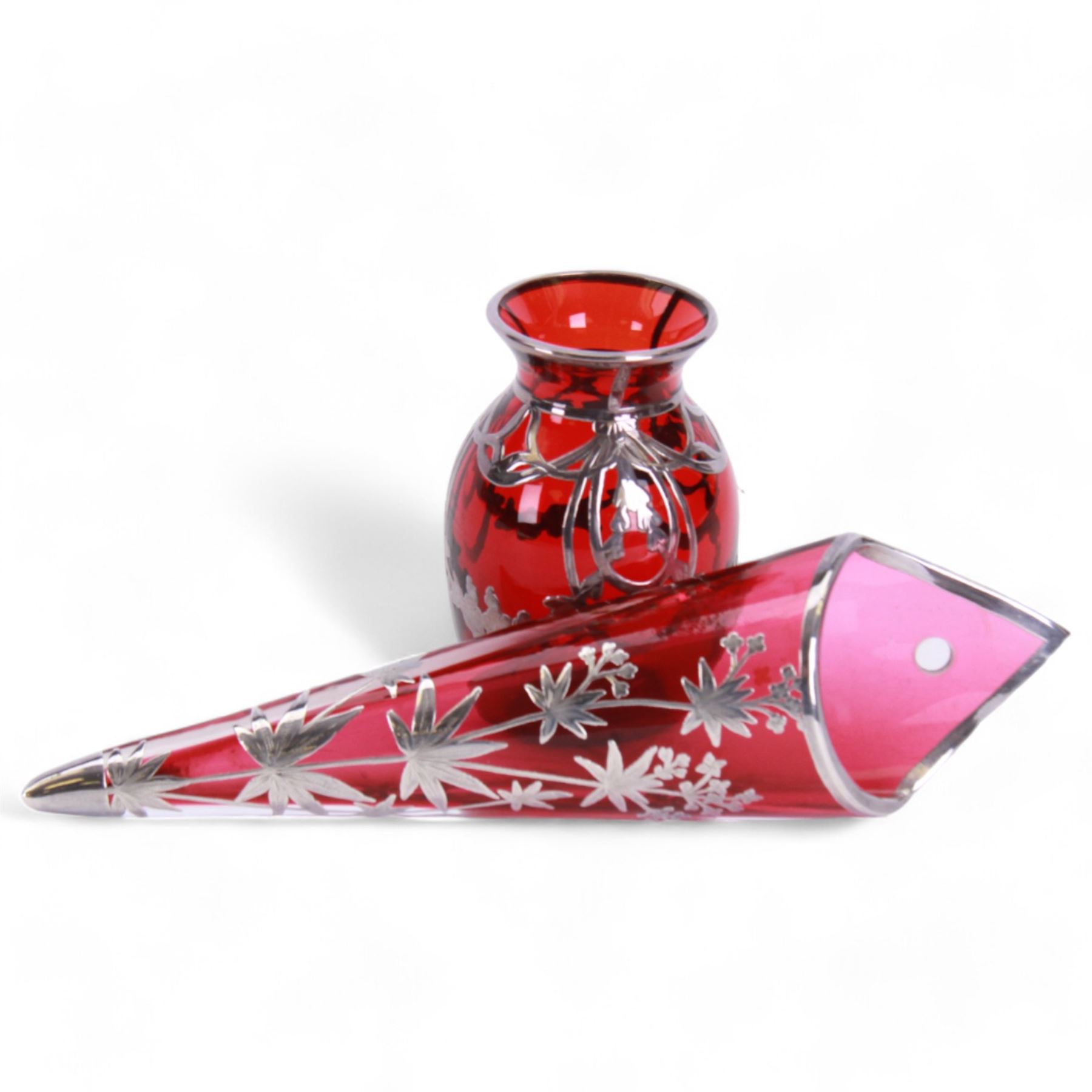 Early 20th century, ruby glass vase vase, with silver overlay of flower swags, impressed sterling H9cm, together with a similar wall vase H21cm,  