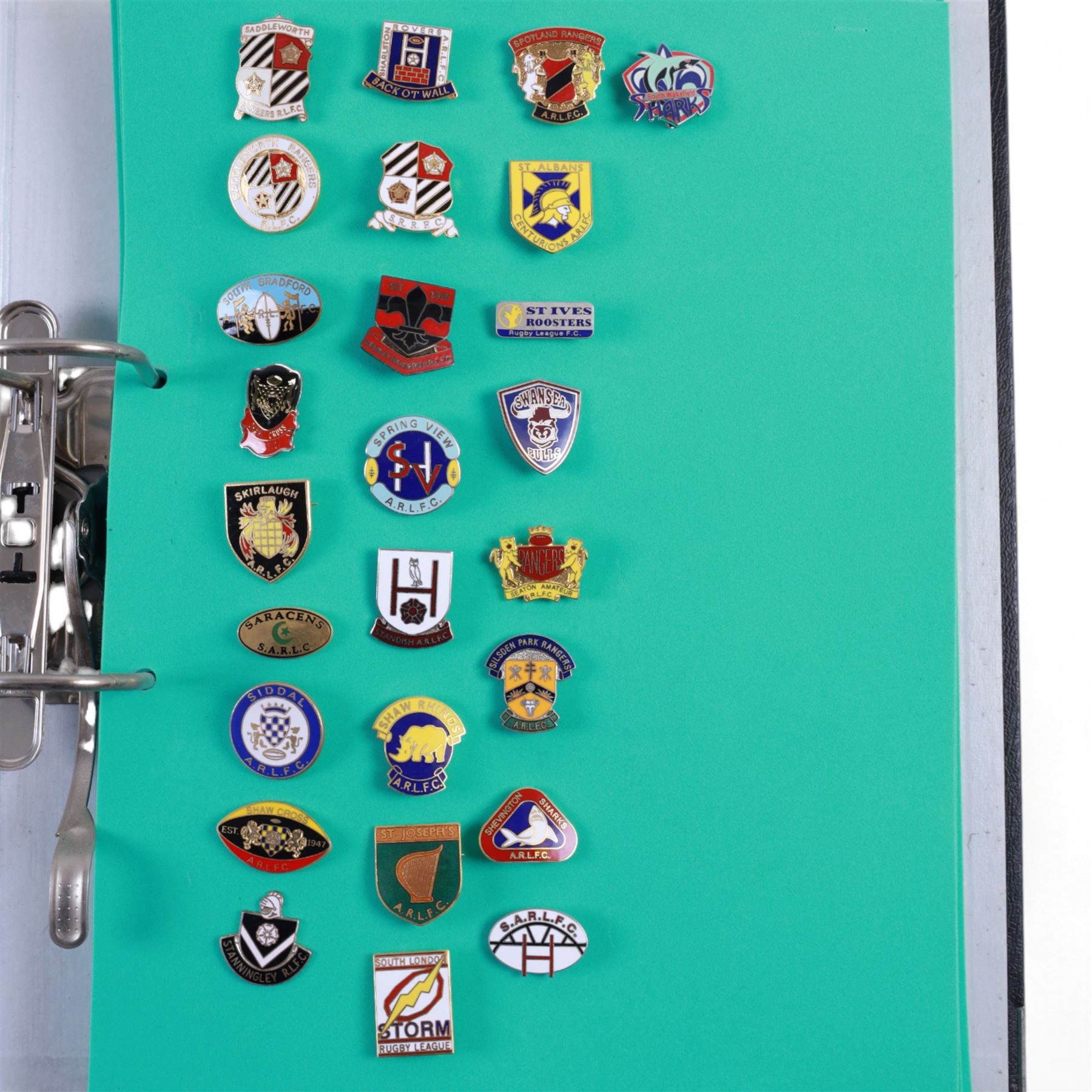Amateur rugby league enamel badge collection, teams including Birmingham Bulldogs, Bridlington, Dudley Hill, Duke of York, Edinburgh Eagles, Guiseley, Rangers, Huntingdon, Keighley Town, Leigh Miners, Pilkington Recs, St Josephs, Thornhill Trojans, West London Sharks etc, all displayed in three folders and six amateur league badges from Leeds & District, Hull & District, York & District, Warrington, Lancashire County and Yorks County in box display, (approximately 270)