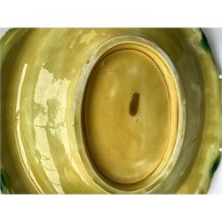 A Victorian majolica bread plate depicting corn within a woven basket, L33cm, together with a Victorian majolica jug modelled in the form of a corn cob, with registration mark beneath, H22cm. 