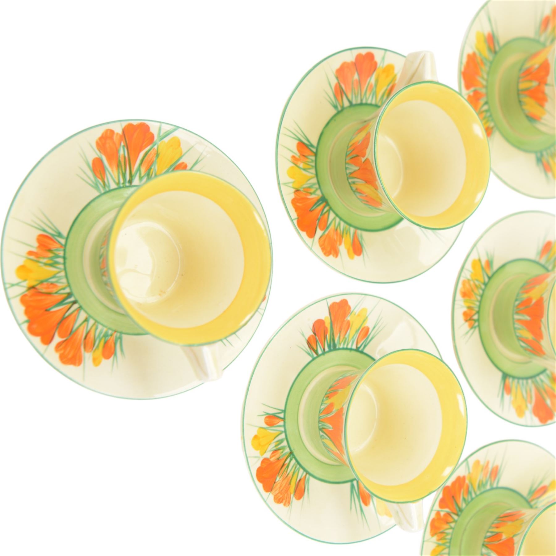 Clarice Cliff Biarritz Bonjour shape tea service for six, in Sungleam Crocus pattern, comprising teapot, milk jug, open sucrier, cups and saucers, all with printed Biarritz by Clarice Cliff  Wilkinson Ltd England beneath, teapot H20cm

