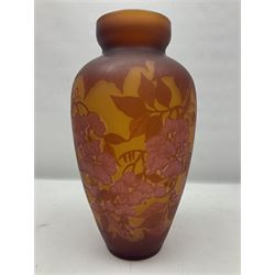 Art Nouveau style glass vase, in the style of Galle, the tapering body decorated with trailing red and pink foliage on a yellow ground, H33cm