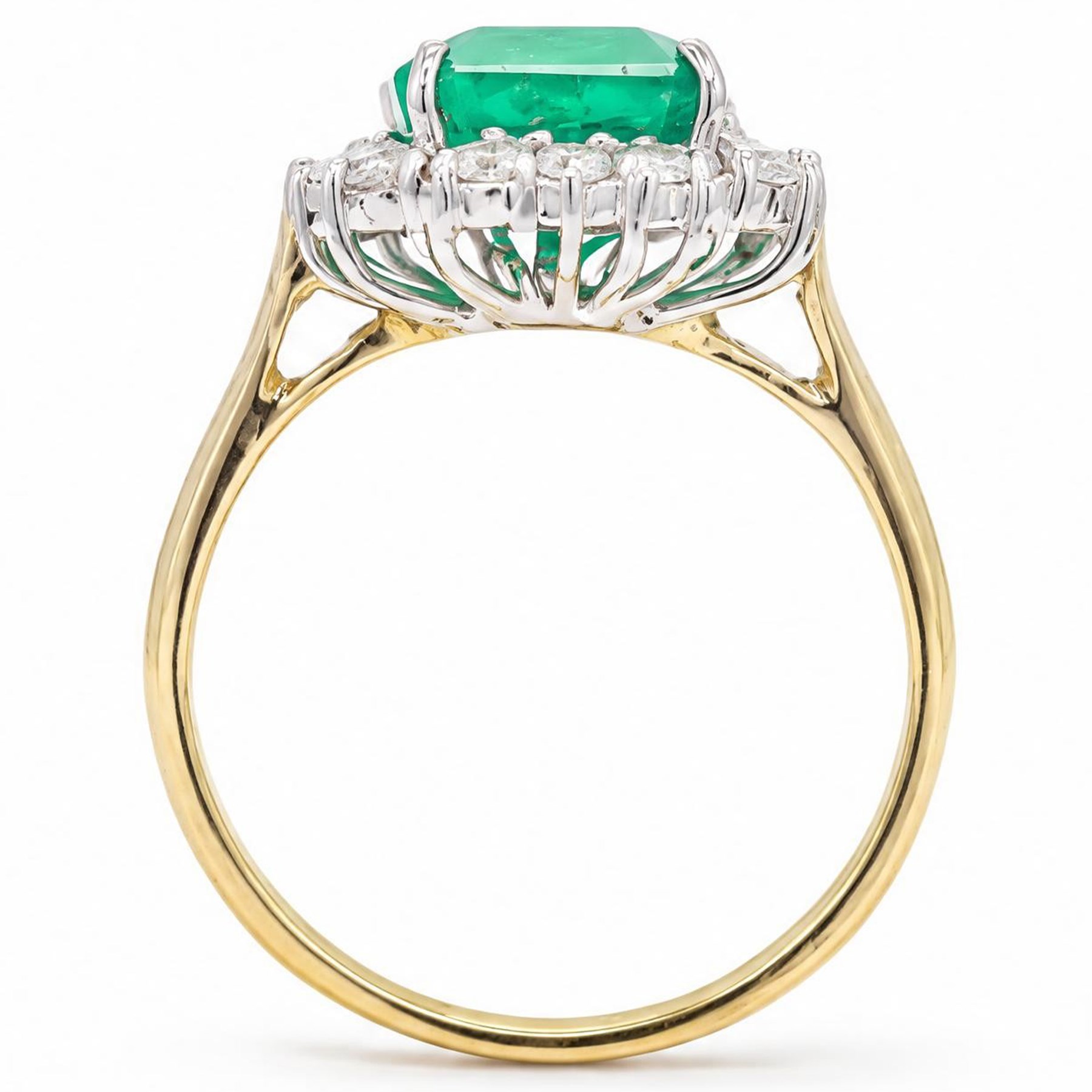 18ct gold emerald and diamond cluster ring, single octagonal cut emerald of approx 3.80 carat, surrounded by sixteen round brilliant cut diamonds, hallmarked, total diamond weight approx 0.50 carat
