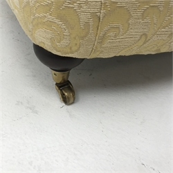 Licoln House wing back armchair, upholstered in a pale gold chenille fabric with floral pattern, shaped back, scrolled arms on turned supports, W91cm