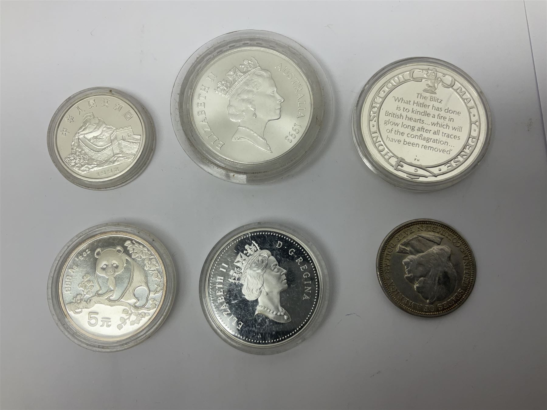 United States of America 1896 Morgan one dollar coin, 1893 'Columbian Exposition' commemorative half dollar, 1945 standing Liberty half dollar, Queen Elizabeth II Australia 1993 one ounce fine silver dollar, Canada 1967 and 1995 one dollar coins etc (15)