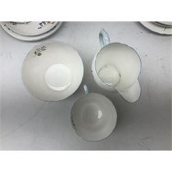 Shelley Wild Flowers pattern part tea service, comprising four cups and saucers, four dessert plates, cake plate, milk jug and open sucrier