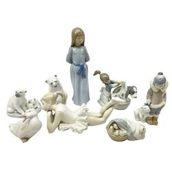 Five Lladro figures, comprising Ducklings no 4895, Polar Bear with Cubs no 5434, Eskimo Boy with Pet no 5238, Bashful Bathing no 5455, and Resting Polar Bear no 1208, together with three Nao figures Duck Looking Back, Girl in Blue Dress and Pensive Ballet, largest example H24cm  