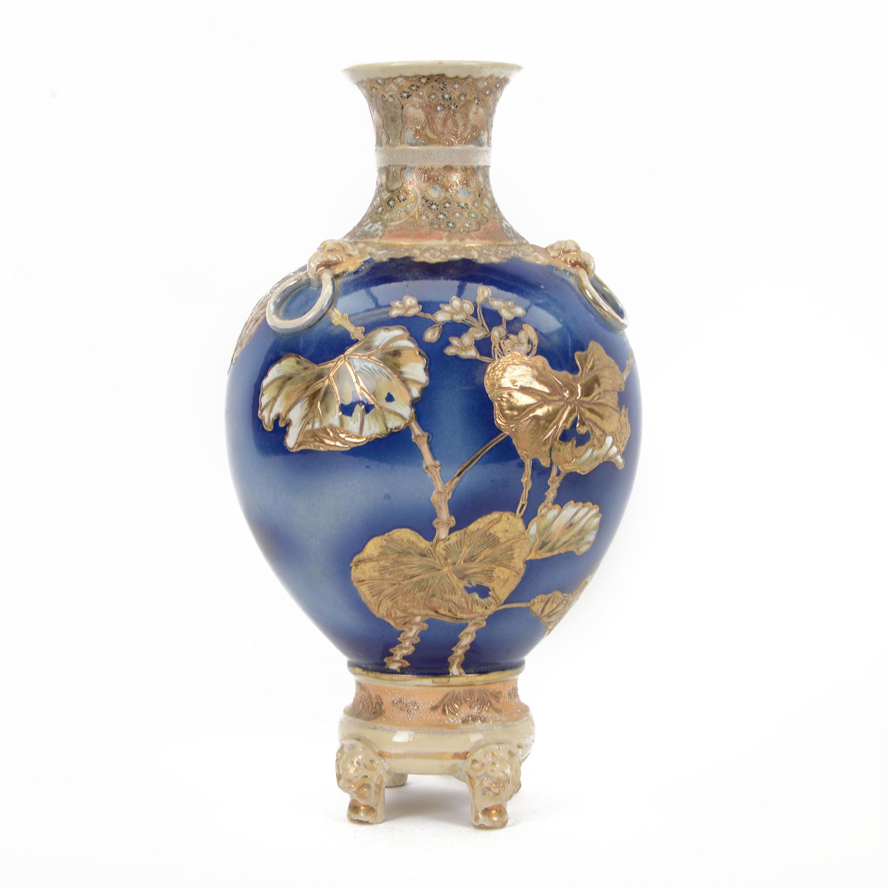 Japanese Satsuma vase, of ovoid form with wasted neck, and three applied mask mounted ring handles, upon four mask detailed feet, the blue ground body painted with blossoming vines, with painted gilt mark beneath, H38cm