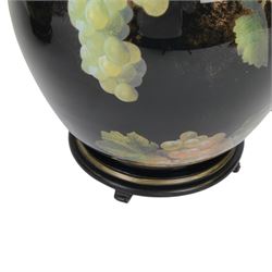 Pair of Jenny Worrall table lamps, of ovoid form, the glass body decorated with fruit and trailing flowers upon a black ground with gilt flecks, with pleated cream lampshades, including shades H65cm