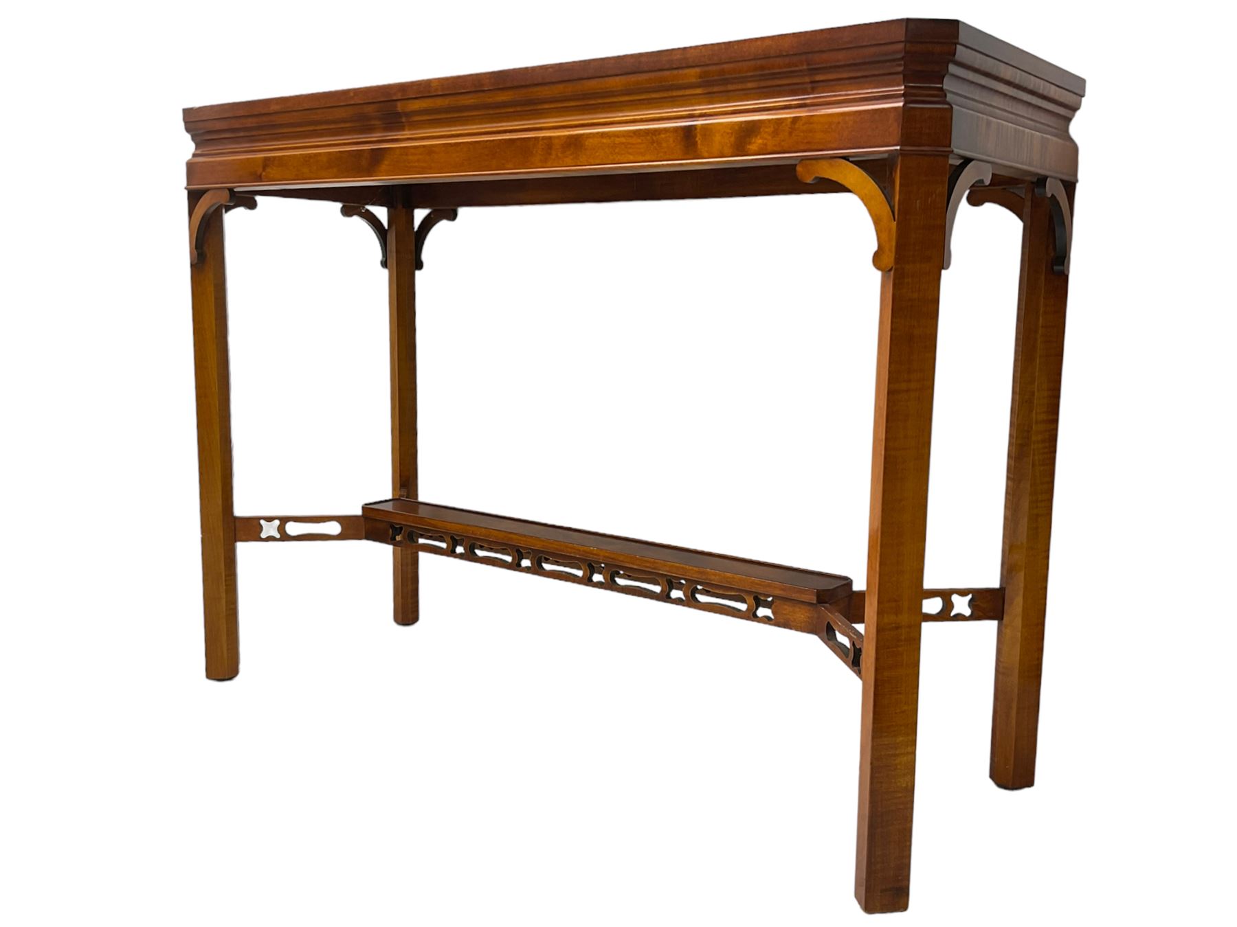 Wade - yew wood console table, rectangular top with canted corners and raised lipped edge, on chamfered square supports united by narrow under-tier