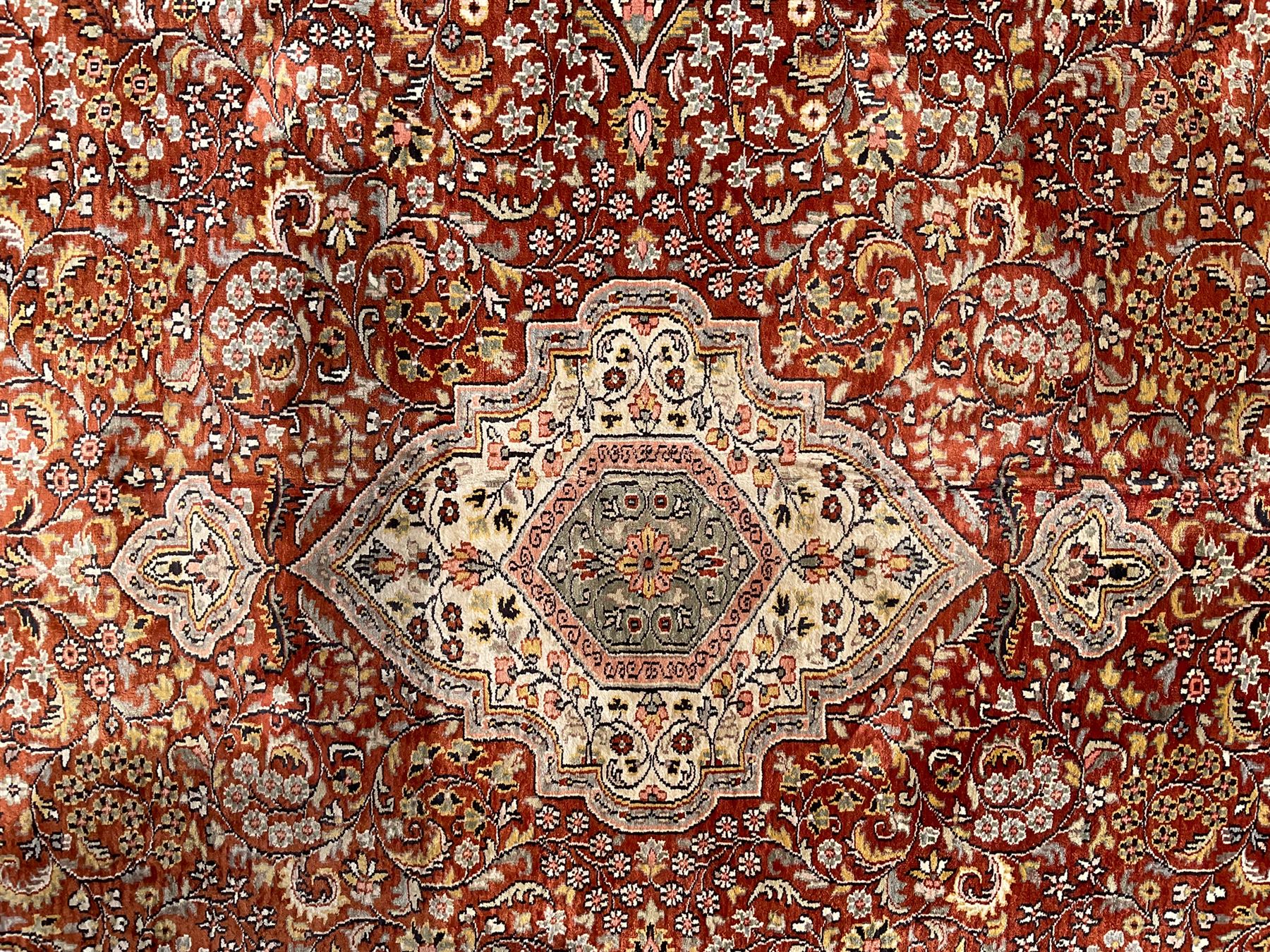 Persian amber ground rug, the central shaped pole medallion surrounded