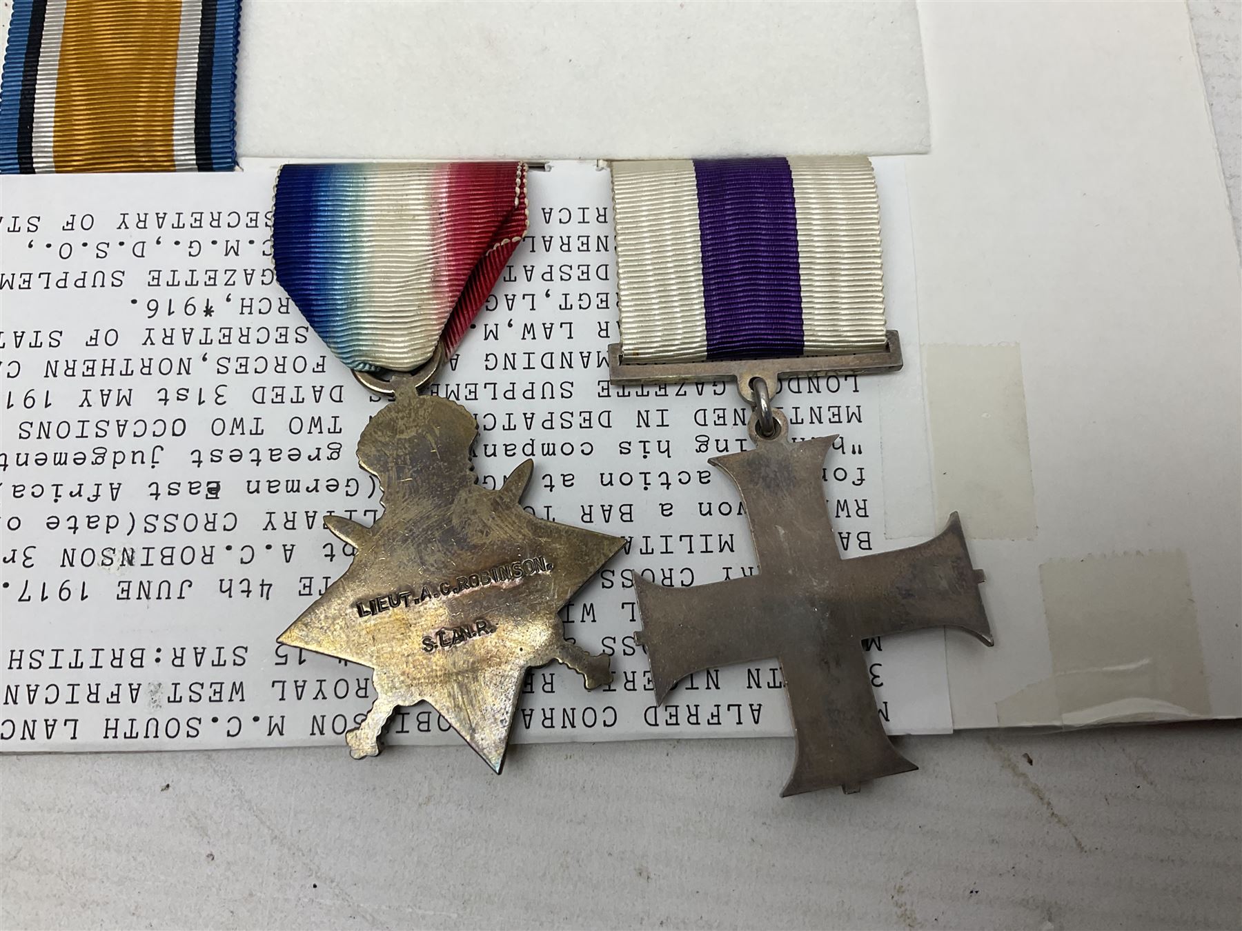 WWI Military Cross group of four awarded to Major Alfred Conrad Robinson South Lancashire Regiment and 3rd Battalion Nigeria Regiment Royal West African Frontier Force comprising MC, British War Medal and Victory Medal with oak leaf, and 1914-15 Star (to Lieut. A.C. Robinson); Military Cross London Gazette 4th June 1917. Bar to Military Cross (Capt. A.C. Robinson 3rd Bn. Nigeria Regt. RWAFF won a bar to his Military Cross (date of award 10th June 1917) for his action at Ngwembe German East Africa on 24th January 1917 for 'Handling his company with great judgement and coolness'. Recommended for a bar to his MC dated 10th June 1917 but never recorded (copy bar included with the medals).Mentioned in despatches on two occasions. Published in the London Gazette Supplements dated 31st May 1916 by Brig-Gen F.J. Cunliffe, commanding Allied Forces Northern Cameroons to the Rt.Hon. A. Bonar Law MP P.C. Secretary of State for the Colonies, H.Q. Nigeria Regiment, Lagos, 16th March 1916; and again London Gazette Supplement 7th March 1918 from Major-Gen A.R. Hoskins C.M.G. D.S.O. Late Commander-in-Chief East Africa Force to the Secretary of Stae for war 5th March 1918; together with an extensive archive of research information and the original bill of purchase from Spink & Son dated 4/11/1959