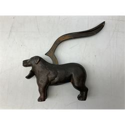Cast metal nutcracker, in the form of a dog together with a pair of Swift Saratoga 8x40 binoculars in leather case and a hip flask, the glass flask covered in leather to the top with a detachable silver plated cup to base