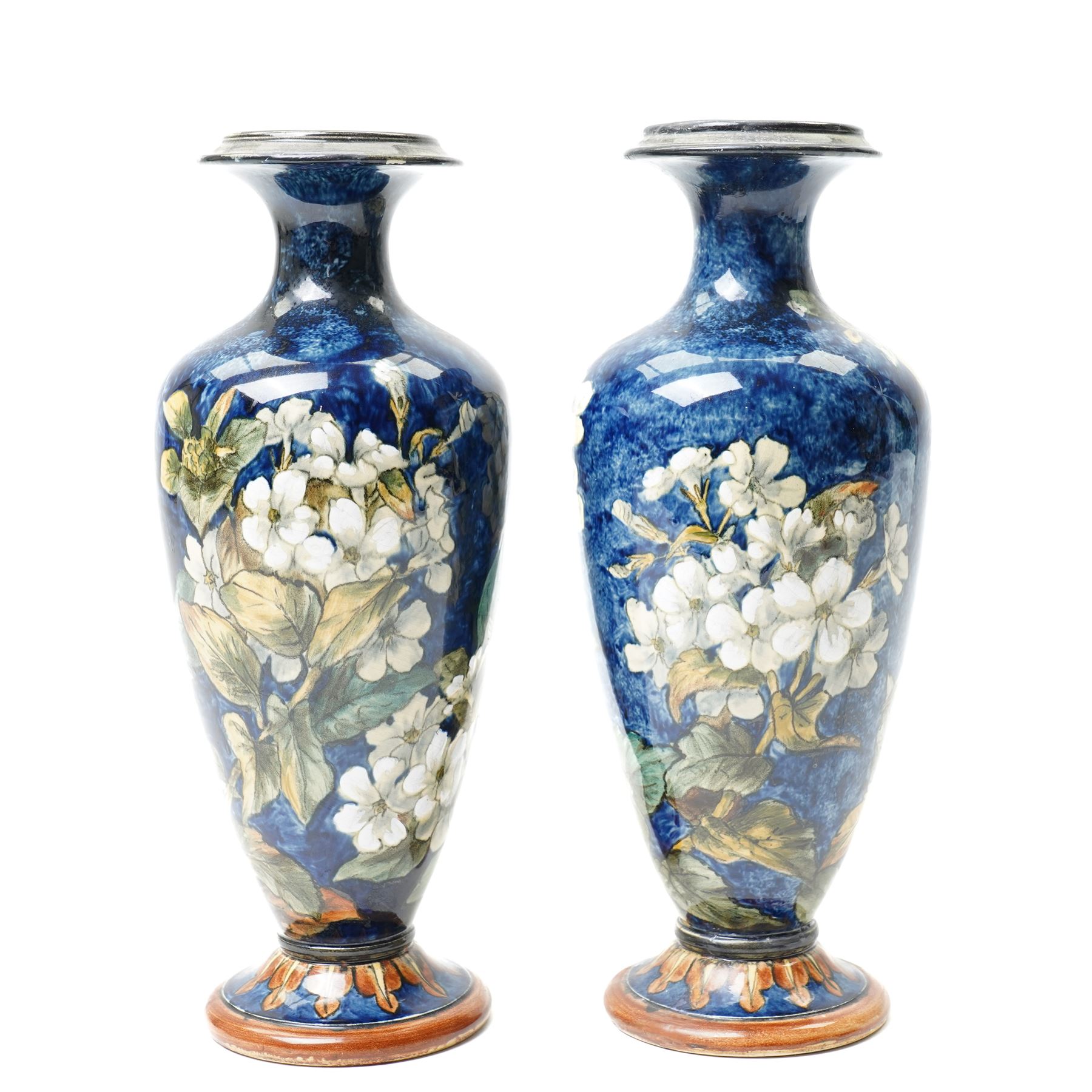 Pair of Doulton Lambeth vases, painted with white flowers, impressed marks to base and signed MA, for Mary Aitken, 1878, H28cm (2)
