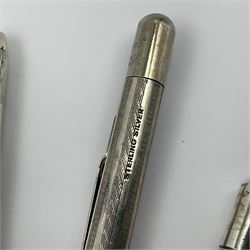 Six silver propelling pencils/pens, including Fyne Point and Longerlead examples, all stamped or hallmarked, together with an Ever Point gold filled example