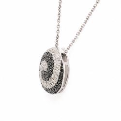 9ct white gold diamond swirl pendant necklace, circular pendant pave set with black and white diamonds, on a fine trace link chain necklace, both hallmarked, total diamond weight approx 1.55 carat