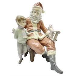 Lladro figure, A Special Toy, modelled as Father Christmas with a young boy, with original box, no 5971, year issued 1993, year retired 1996, H26cm