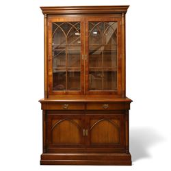 Edwardian mahogany bookcase cabinet, the moulded cornice above a pair of astragal glazed d...