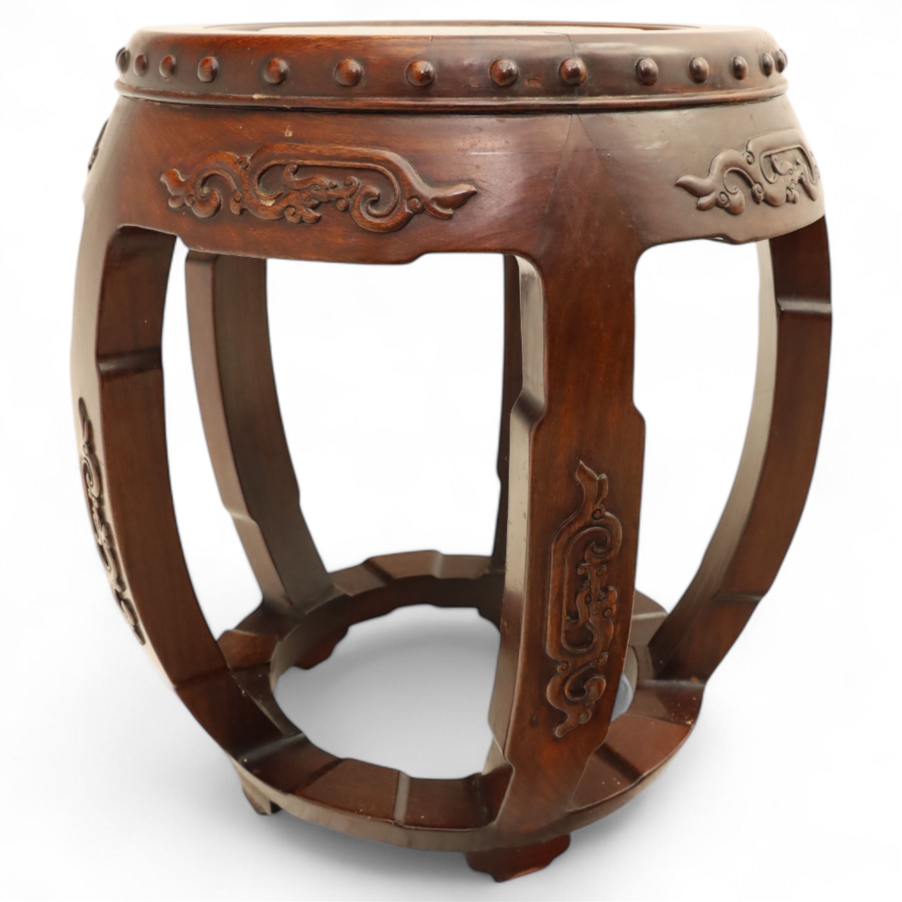 Pair of early 20th century Oriental hardwood barrel seats, of drum form with shaped apron and pierced panels, carved with stylised scrollwork and studded detail to the top