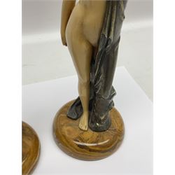 After Ferdinand Preiss (1882-1943), pair of Art Deco style, composite semi nude classical female figures, raised on circular onyx bases, H21cm