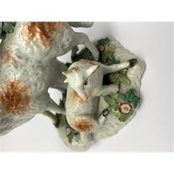 18th century Derby porcelain group, modelled as a ram standing before bocage above a recumbent lamb, upon flower encrusted base, H13.5cm, together with an 18th century Derby figure modelled as a deer, in recumbent pose before bocage, H8cm, each with patch marks beneath, 