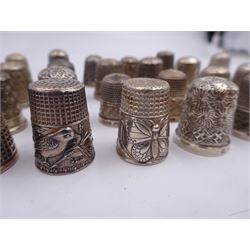 Collection of thirty Victorian and later silver thimbles, the majority fully hallmarked, others stamped Sterling and 925, approximate total weight 4.50 ozt (140 grams)