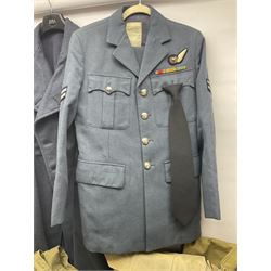 Two post-WWII British Army No.2 Dress tunics, one with Green Howards buttons; army shirt dated 1951; Royal Fleet Auxilliary jacket with trousers; three RAF/WAAF uniforms and RAF Greatcoat; and three canvas/webbing bags, two dated 1943 & 1945