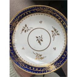  19th century Coalport Felt Spar porcelain cup and saucer painted with panels of flowers on a green and gilt ground and marked I Rose & Co and an early 19th century Worcester trio decorated in blue and gilt, Pattern No.274 