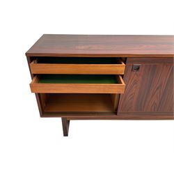 NH Chapman & Co Siesta - mid-20th century sideboard, fitted with three sliding doors, enclosing two drawers and shelves, raised on twin end supports