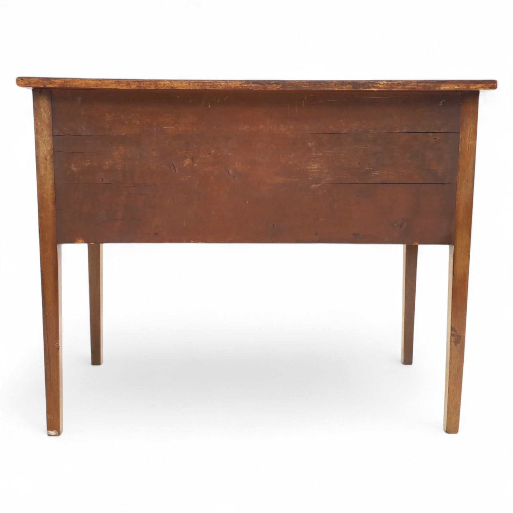 Early 19th-century mahogany kneehole desk with ebony stringing, rectangular top above an arrangement of one long and four short drawers, each with brass knob handles, raised on square tapered legs