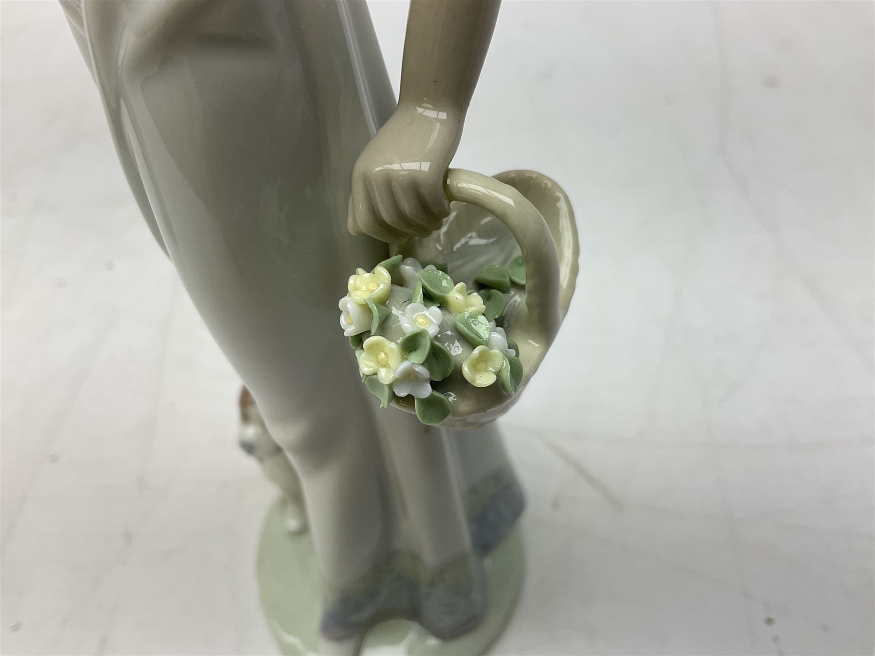 Two Lladro figures, comprising Garden Classic, no 7617 and Garden Song, no 7618, with original boxes and artists signature beneath, largest example H23cm