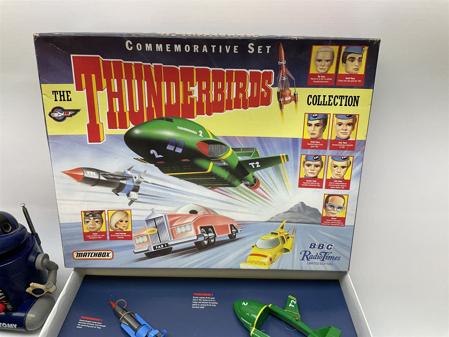 Matchbox 'The Thunderbirds' limited edition Commemorative Set, boxed with paperwork; Tomy 'Mr. D.J.' blue plastic robot radio; Mettoy Walt Disney Movie Viewer with three cassettes; and 1995 boxed set of the Star Wars trilogy VHS video tapes