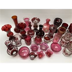 A group of 19th century and later cranberry and ruby glassware, including a small number of Bohemian examples, to include various vases, lidded jars, drinking glasses, etc. 
