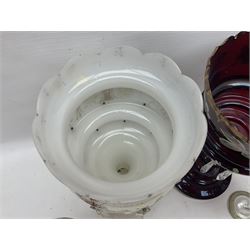 Bohemian red glass lustre, painted with stylised floral and foliate decoration, together with a milk glass example and two bohemian goblets converted to lustres 