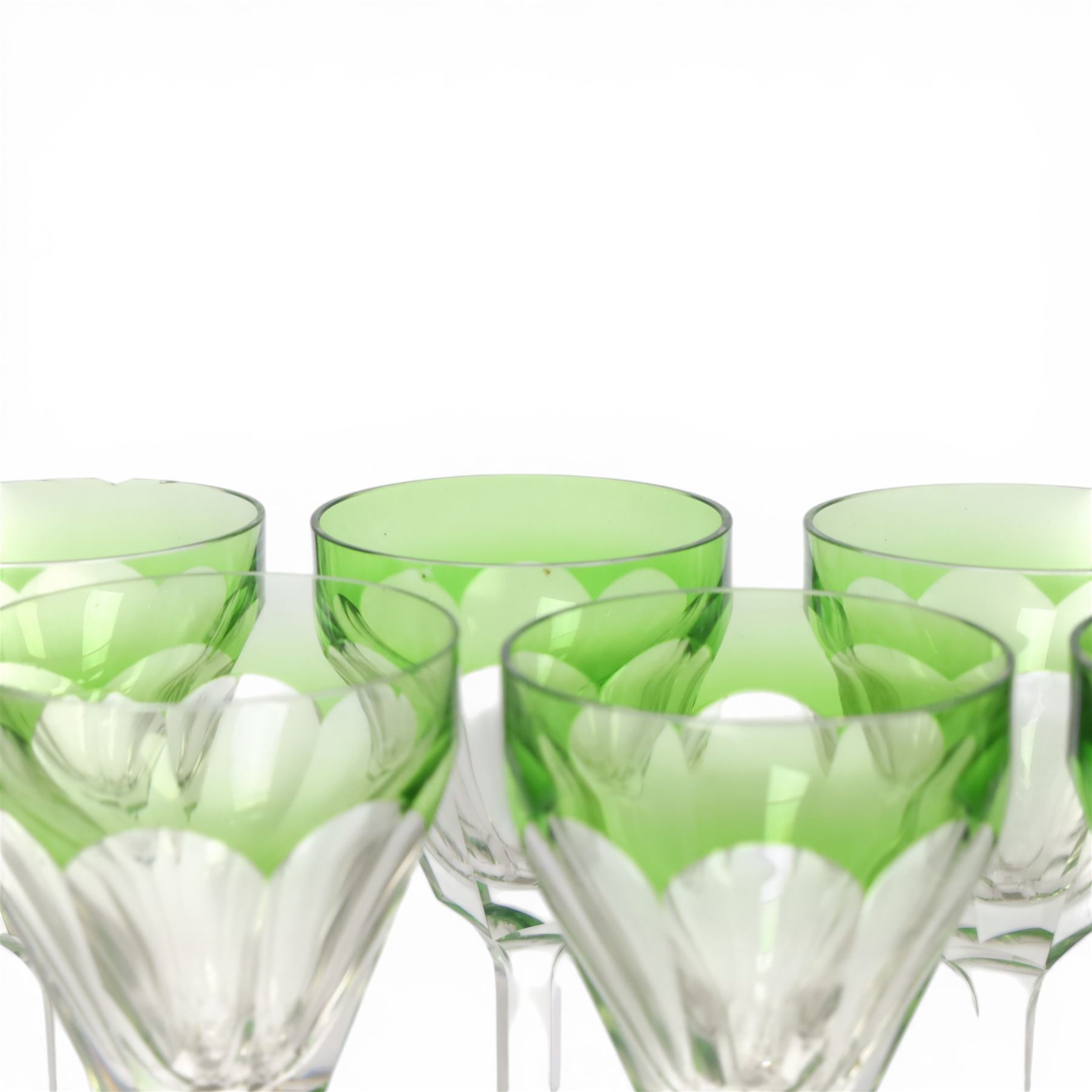 Set of ten wine glasses, of fluted form with chartreuse rim, upon a faceted stem, H20cm  