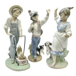 Three Lladro figures, comprising Saturday's Child Boy no 6021, Wednesday's Child Boy no 6015 and Wednesday's Child Girl no 6016, all with original boxes, largest example H20cm 