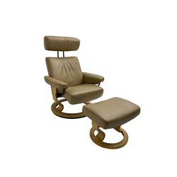 Ekornes Stressless - reclining armchair upholstered in latte leather, with footstool