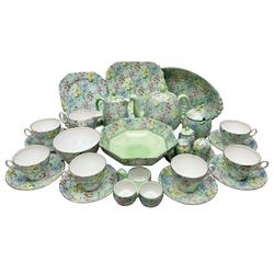 Shelley Melody pattern tea service for six, to include teapot, teapot stand, hot water jug, milk jug, covered sucrier, teacups and saucers, cake plates etc (31)