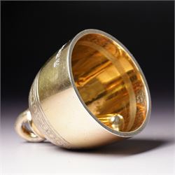 Late Victorian silver gilt table bell with reeded and roundel decoration and loop handle, bell and clapper both hallmarked H7cm London 1900 Maker R & S Garrard & Co