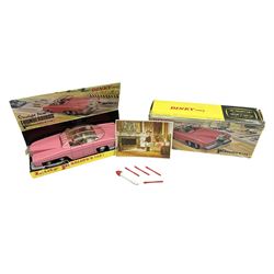 Dinky - Lady Penelope's FAB1 No.100,  in pink with clear sliding roof with pink stripes, Lady Penelope and Parker figures, four plastic harpoons plus red and white missile and flying lady mascot to radiator; boxed with inner card stand