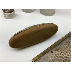 Edwardian silver mounted purse, with circular panel engraved with initials, and hammered finish, hallmarked William Comyns & Sons, London 1903, H14cm, together with three dressing table glass jars with hallmarked silver covers, and a hallmarked silver mounted buffer 